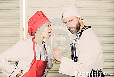 Cooking is sexy. Sharp knife professional tool. Man use sharp cleaver knife. Couple playful with dangerous knife. Metal Stock Photo