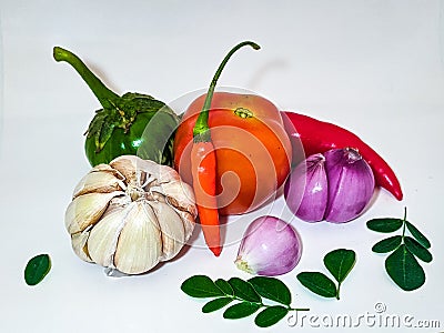 cooking spices such as tomatoes, chilies, garlic, onions and eggplants Stock Photo