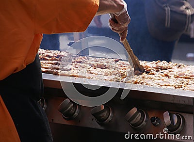 Cooking spicy kebabs at street fair, Stock Photo