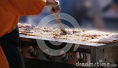 Cooking spicy kebabs at street fair Stock Photo