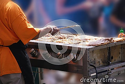 Cooking spicy kebabs at street fair Stock Photo