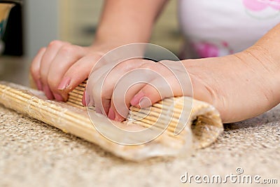 Cooking sushi. DIY food. Eastern cuisine. Lesson in the kitchen Stock Photo