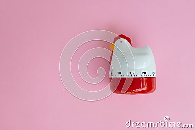 Cooking timer as chicken on pink background Stock Photo