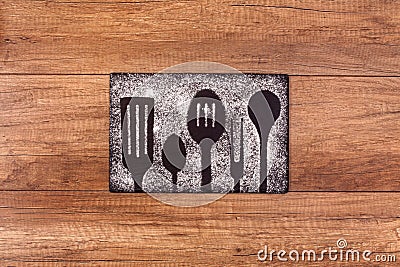 Cooking utensils silhouette drawing in flour Stock Photo