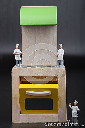 Cooks miniatures on a kitchen Stock Photo