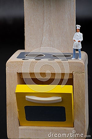 Cooks miniatures on a kitchen Stock Photo