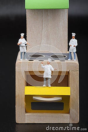 Cooks miniatures on a kitchen Stock Photo