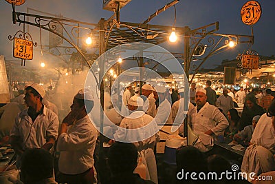 Cooks preparing food at outdoor food stalls Editorial Stock Photo