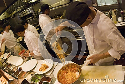 Cooks at work Editorial Stock Photo