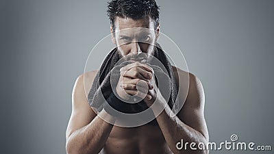 Cool athletic man posing with towel Stock Photo