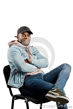 Cool awesome afro hipster enjoying sitting on the chair Stock Photo