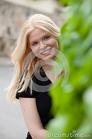 Cool blonde girl surrounded by nature Stock Photo