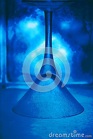 Cool blue upside down frosted martini glass Stock Photo