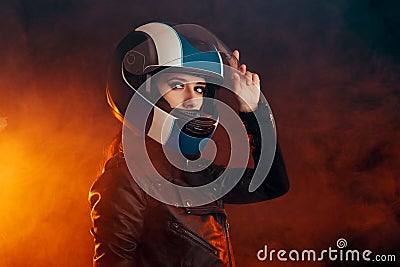 Biker Woman with Helmet and Leather Outfit Portrait Stock Photo