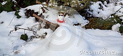 Cool funny Santa Claus with sun glasses sitting on the snow Stock Photo