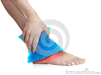 Cool gel pack on a swollen hurting ankle. Stock Photo