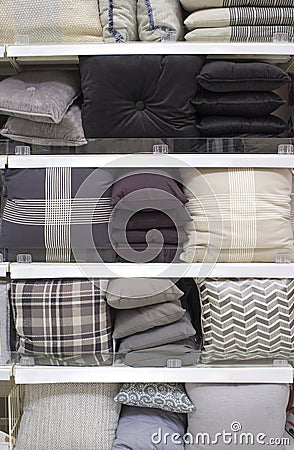 Cool gray scale cushions and bed wear on shelves Stock Photo