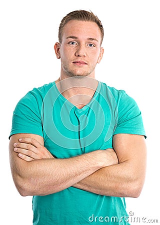 Cool isolated young sportive blond man in green shirt. Stock Photo