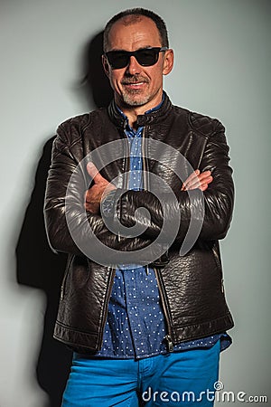 Cool senior casual man in leather jacket and sunglasses Stock Photo