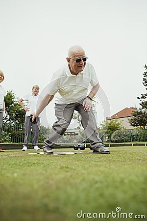 Cool Senior Man Lawn Bowling Stock Photo