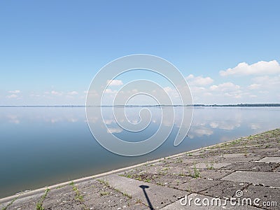 Cool shore and landscape of artificial european Goczalkowice Reservoir in Poland with beauty clouds on blue sky Stock Photo