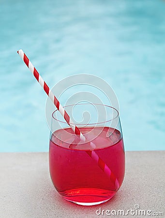 Cool summer cocktail by the pool stripe straw Stock Photo