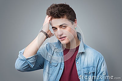 Cool teenager touching his hair Stock Photo