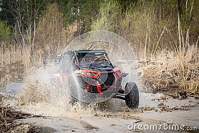 Cool view on hard ride UTV in muddy water Stock Photo