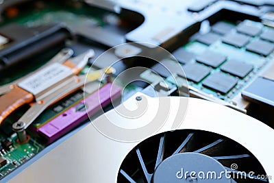 A cooling system of computer. A fan, cooler of central processing or the CPU cooler pc system unit.Electronic circuit board close Stock Photo