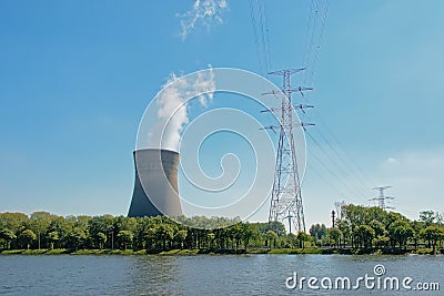 Cooling tower and high voltage electricity mast in the harbor of Ghent Stock Photo