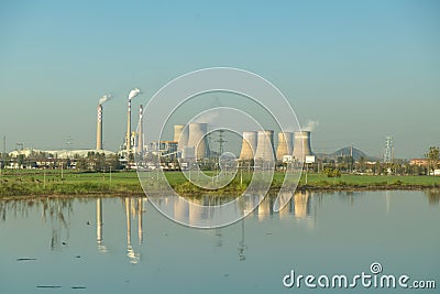 Cooling towers reflection in lake, China Editorial Stock Photo