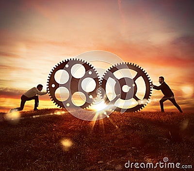 Cooperation at work concept with gears mechanism Stock Photo