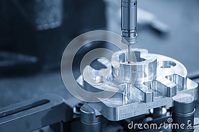 The Coordinate Measuring machine ,CMM probe measure dimension of the aluminium engine block parts . Stock Photo