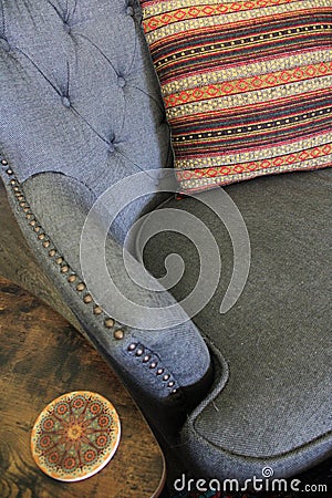 Coordinated orange, beige, and brown pillow and coaster Stock Photo