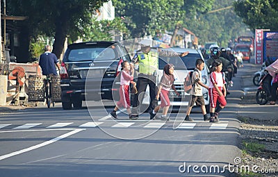 Cop Helps Child Editorial Stock Photo