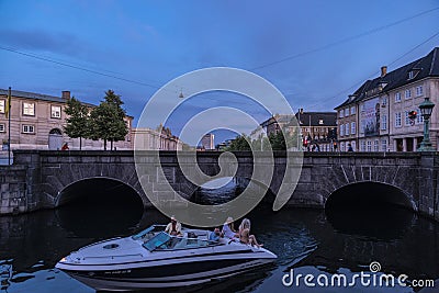 People on board a yacht at sunset in Copenhagen, Denmark Editorial Stock Photo