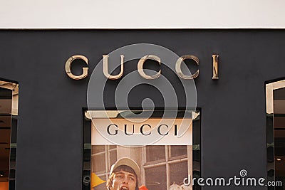 The sign of Gucci at Gucci on store. Gucci is an Italian fashion and leather goods brand. Editorial Stock Photo