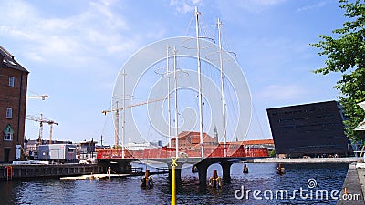 COPENHAGEN, DENMARK - JUL 05th, 2015: The new Circle Bridge with masts like a ship in Copenhagen harbor, against the Editorial Stock Photo