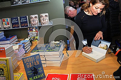 SISSEL-JO GAZAN_FEMALE AUTHOR SIGNS BOOKS Editorial Stock Photo