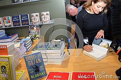 SISSEL-JO GAZAN_FEMALE AUTHOR SIGNS BOOKS Editorial Stock Photo