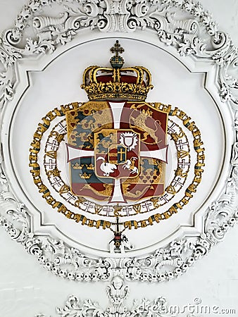 Code of Arms with intricate framing designs on the ceiling Editorial Stock Photo