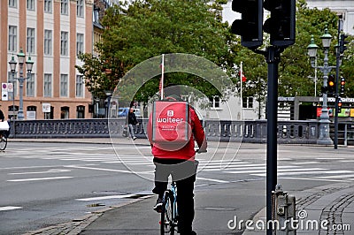 Waiteer deliverly biker in Copenhagen Denmark Editorial Stock Photo