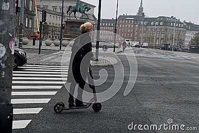 FEALE RIDE ESCOOTER IN COPENHAGEN DENAMRK Editorial Stock Photo