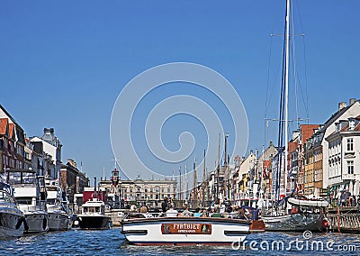 Copenhagen, Denmark - Touristic boat enters in Nyhavn Editorial Stock Photo