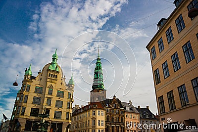 COPENHAGEN, DENMARK: View of the landmark green spire of the former St. Nicholas Church, now Nikolaj Contemporary Art Center in Editorial Stock Photo