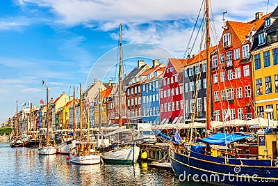 Copenhagen iconic view. Famous old Nyhavn port in the center of Copenhagen, Denmark during summer sunny day Editorial Stock Photo