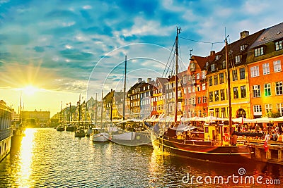 Copenhagen iconic view. Famous old Nyhavn port in the center of Copenhagen, Denmark during sunset Editorial Stock Photo