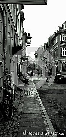 Danish capital street.The capital of Denmark. Bicycle and car on the street Editorial Stock Photo