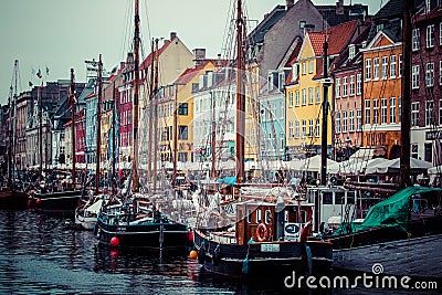 COPENHAGEN: Yacht in Copenhagen sea front in summer. Nyhavn is old waterfront and canal district Editorial Stock Photo