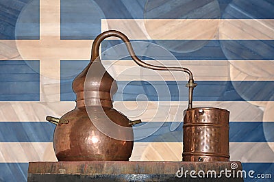 Copper alambik on the background of the national flag of Greece. Winemaking and distillery. Stock Photo